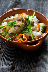 Delicious baked chicken breast and rice with chili and salad