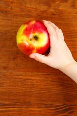 children holding red apple. Top view. vertical shot