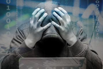 disappointed hacker with computer notebook