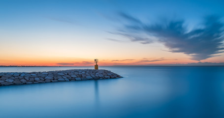 seascape sunset with intense blue sky and sea. Long exposure