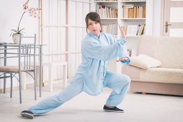 Woman doing qi gong tai chi exercise