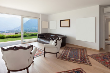 Living room with white armchairs