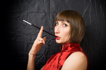 Obraz premium woman with a cigarette holder