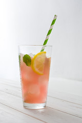 Fresh watermelon mojito on white wooden table
