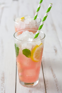 Fresh watermelon mojito on white wooden table
