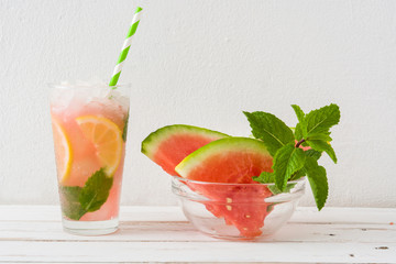 Fresh watermelon mojito on white wooden table
