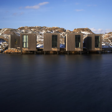 Modern buildings on rocky coast