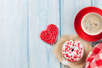 Donut, heart shaped candy and coffee