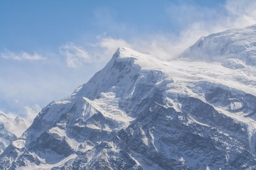 Fototapeta na wymiar snow capped mountain peak in the Himalayas