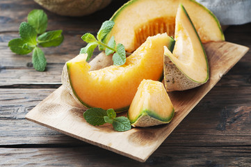 Fresh sweet orange melon and green mint