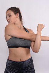 Fototapeta na wymiar Athlete young woman doing exercise.
