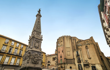 Fototapeta na wymiar Church of San Domenico Maggiore and statue of Saint Dominic in Piazza San Domenico Maggiore,on Spaccanapoli,one of the main streets of the original Greek city of Neapolis