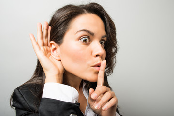 Business woman eavesdropping