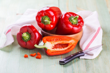 Fresh organic bell peppers on a wooden board