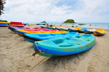 Naklejka na ściany i meble Sea kayaks on the beach