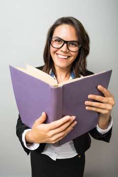 young woman looking in a book