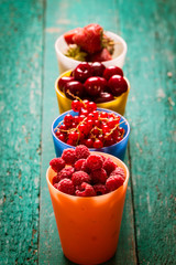 Fresh summer berries , wooden background, healthy food.