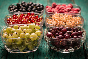 Fresh summer berries , wooden background, healthy food.