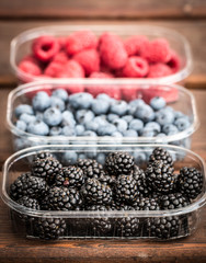 Fresh summer berries , wooden background, healthy food.