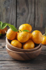 Sweet orange mandarin on the wooden table