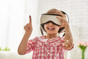 girl playing in virtual reality glasses