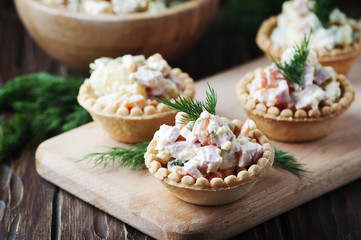Traditional russian salad Olivier served in tartlet