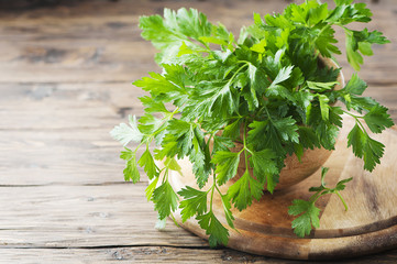 Green fresh parsley on the vintage table