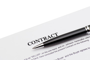 Close-up of pen on contract 