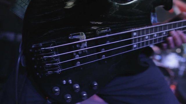 Rock Concert. Rock Musician Playing Bass Guitar