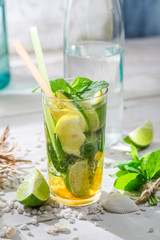 Cold summer drink with lemon, lime and sugar