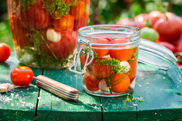 Small jar of tomatoes during preserving
