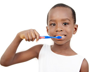 Child brushing his teeth.
