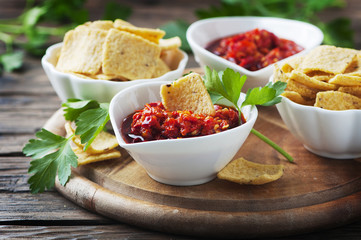 Hot mexican salsa with chili peppers and chips