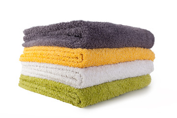 Four colorful towels isolated on white background