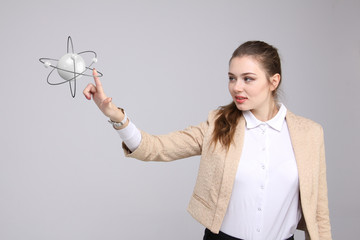 Woman scientist with atom model, research concept