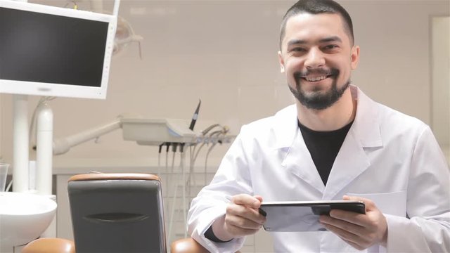 Dentist uses tablet in his cabinet