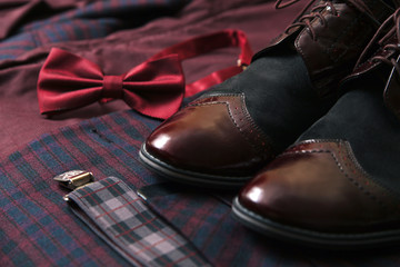 Men burgundy suit, bow tie and vintage leather shoes