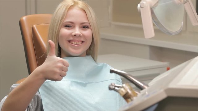 Woman okays checkup at the dentist