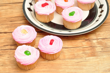 Pink cupcakes displayed on a plate