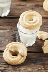 Sweet cookie and glass of milk on the vintage table