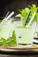Green sweet cocktail with fresh mint and ice