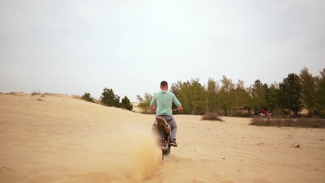 Family spending time together and having fun in Oleshky sands.Ukraine. Slow motion