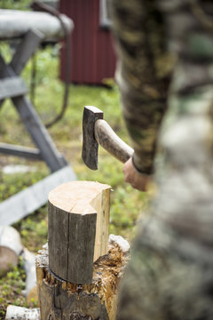 Woman chopping wood