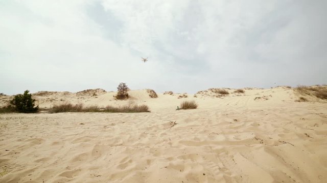 Family spending time together and having fun in Oleshky sands.Ukraine. Slow motion