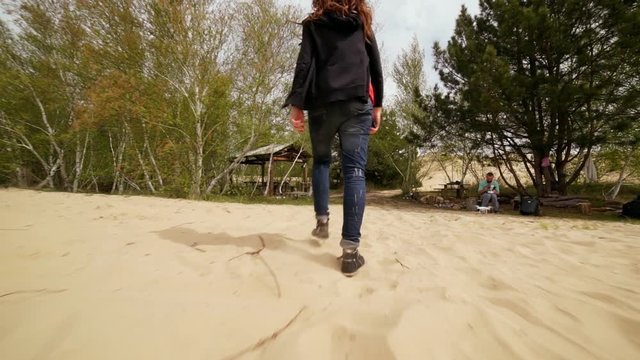 Family spending time together and having fun in Oleshky sands.Ukraine. Slow motion