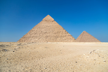 Pyramids of Giza complex ( Egypt) against the clear blue sky.