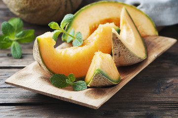 Fresh sweet orange melon and green mint