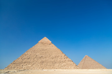 Pyramids of Giza complex ( Egypt) against the clear blue sky.