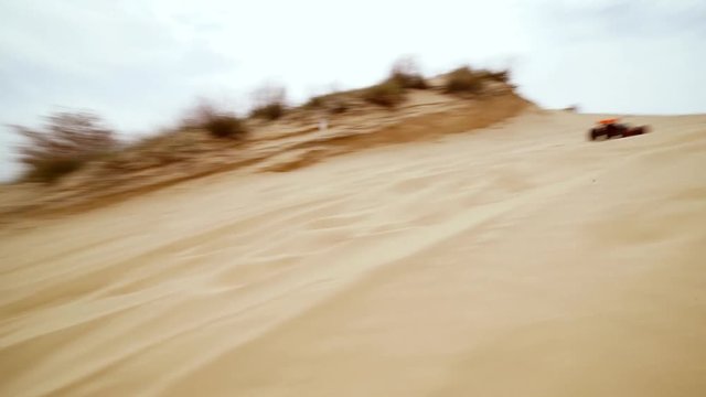 Family spending time together and having fun in Oleshky sands.Ukraine. Slow motion