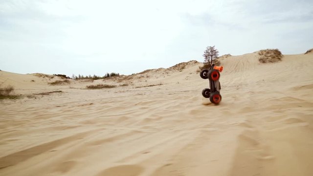 Family spending time together and having fun in Oleshky sands.Ukraine. Slow motion